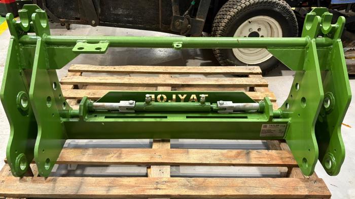 New Taylor hydraulic locking attachment carrier adaptation bracket